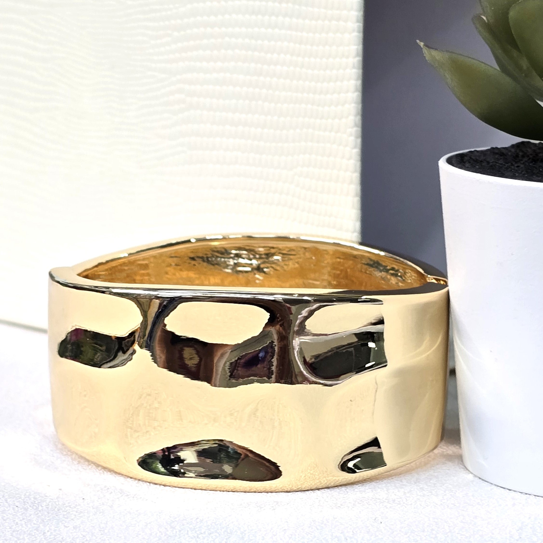 Wide gold cuff bracelet
