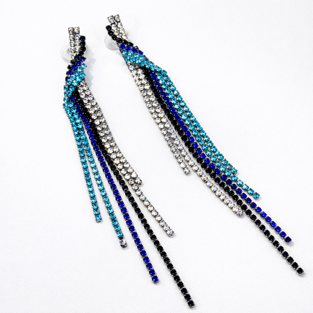 Make a bold statement with DKANE DESIGNS Ocean Cascade Rhinestone Tassel Earrings featuring sparkling blue, black, and crystal stones in an elegant cascading design. Lightweight, glamorous, and perfect for parties, weddings, evening events, and stylish festive looks. Crafted for premium shine and long-lasting comfort