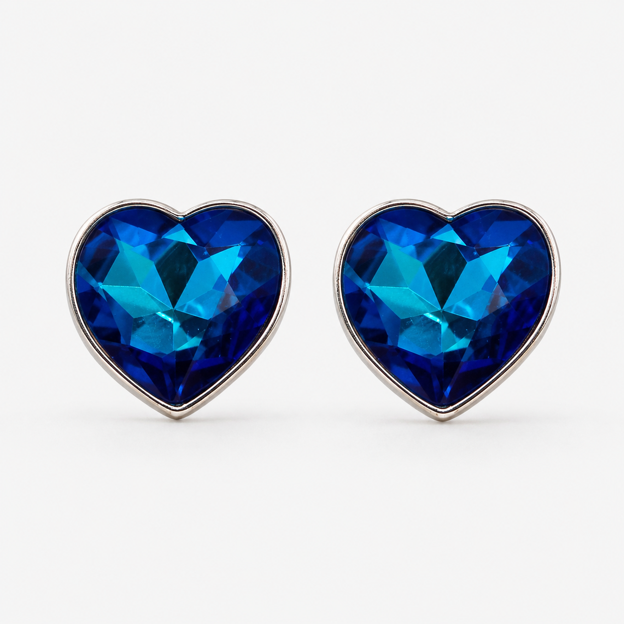 best blue crystal earrings in India, premium heart stud earrings, sapphire earrings for women, luxury fashion jewellery India, elegant stud earrings for women, blue gemstone earrings online India, heart earrings gift for women, premium crystal jewellery, affordable luxury earrings, DKANE Designs jewellery