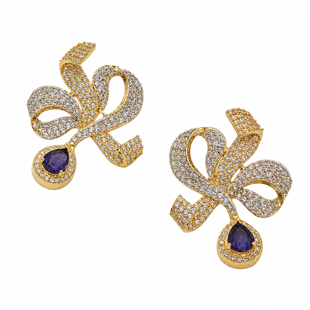 bow earrings, ribbon earrings, purple drop earrings, amethyst earrings, luxury earrings, statement earrings, CZ earrings, cubic zirconia earrings, anti tarnish earrings, designer earrings, premium earrings, crystal earrings, gold earrings, silver tone earrings, party wear earrings, wedding earrings, festive earrings, elegant earrings, women's fashion jewellery, luxury fashion jewellery, purple gemstone earrings, teardrop earrings, bridal earrings, lightweight statement earrings, sparkling earrings, trendy e